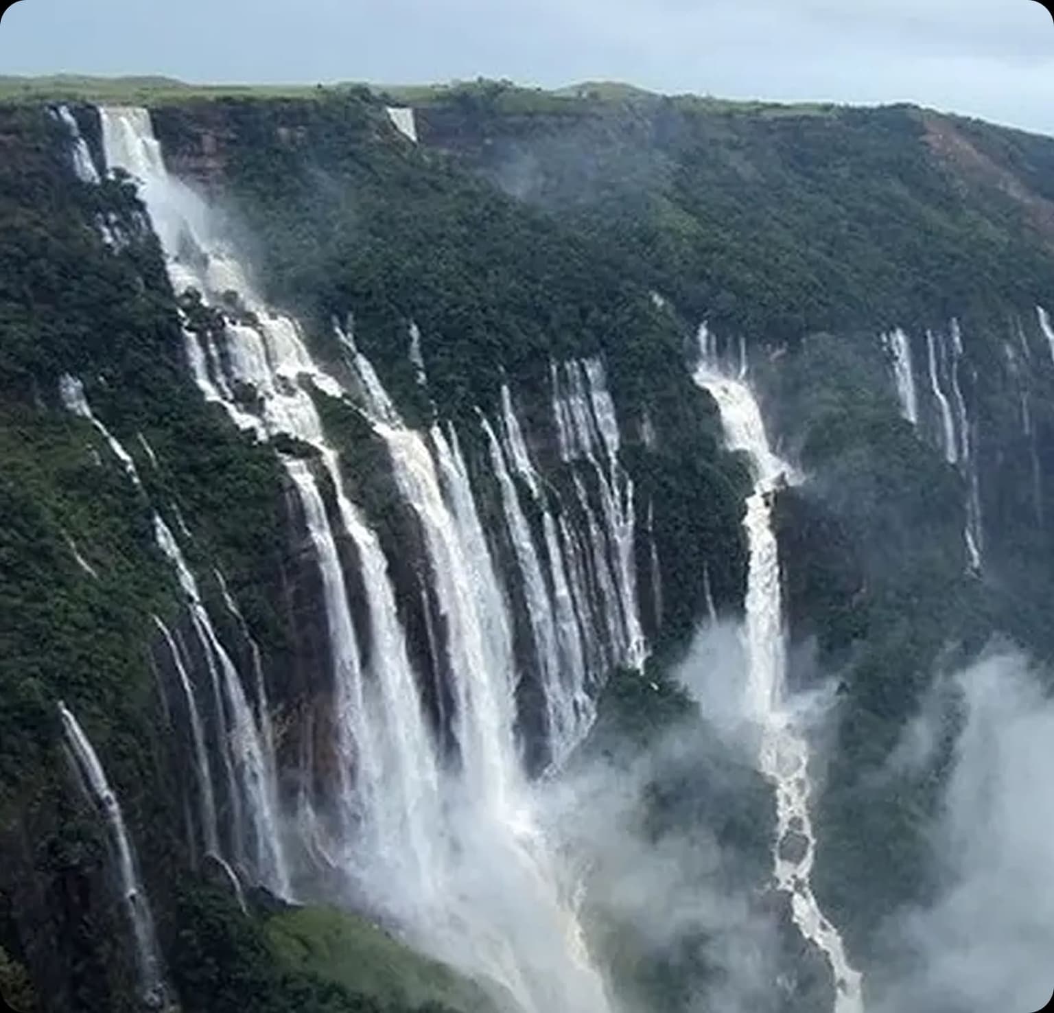 Seven Sisters waterfall cascading down green cliffs in Meghalaya