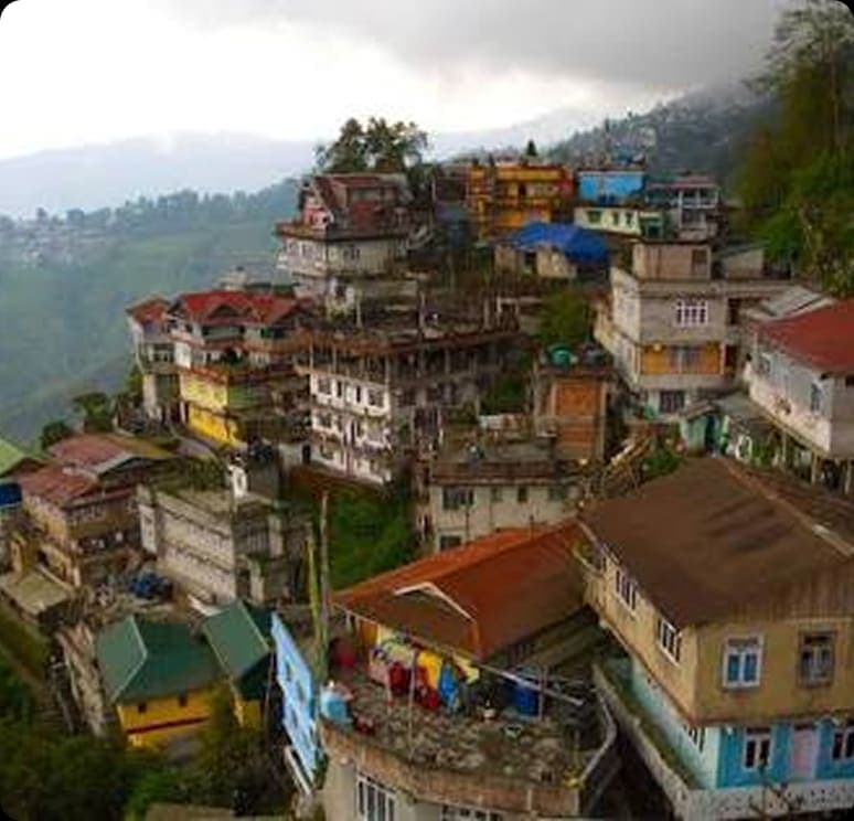 Green Sikkim valley with mountains in the distance